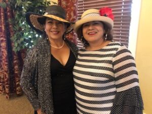 ladies in hats and gloves at Centennial Tea