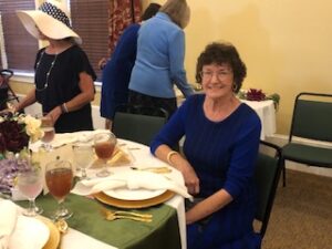 ladies in hats and gloves at Centennial Tea